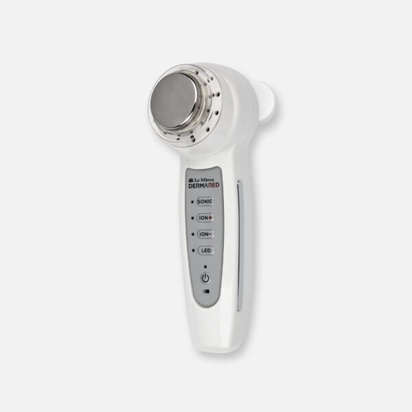 A white device with a silver button on it.