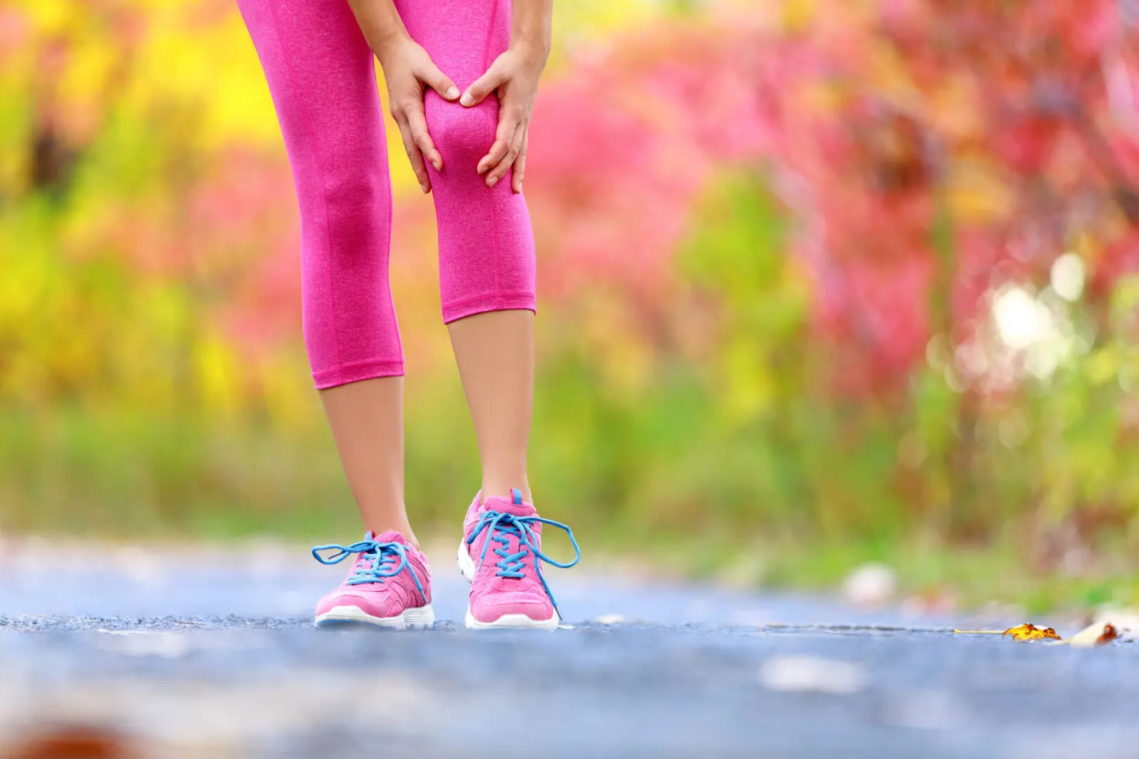 Joint pain while walking outdoors in forest.