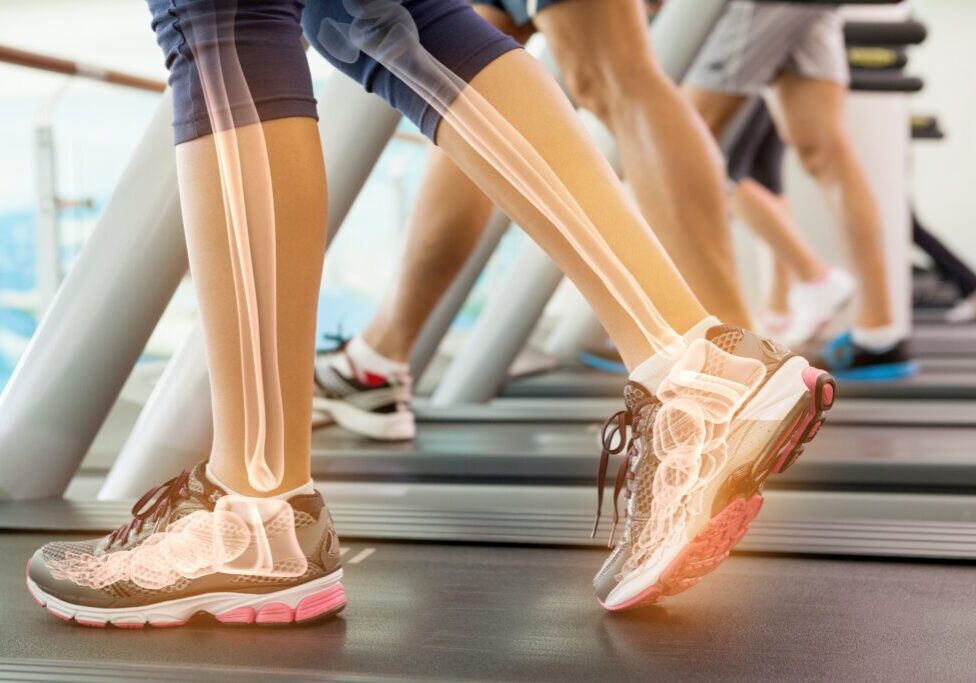 Digital composite of Highlighted ankle of woman on treadmill