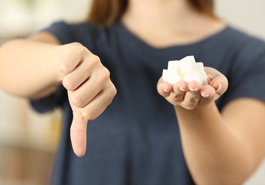 woman-holding-sugar-thumbs-down